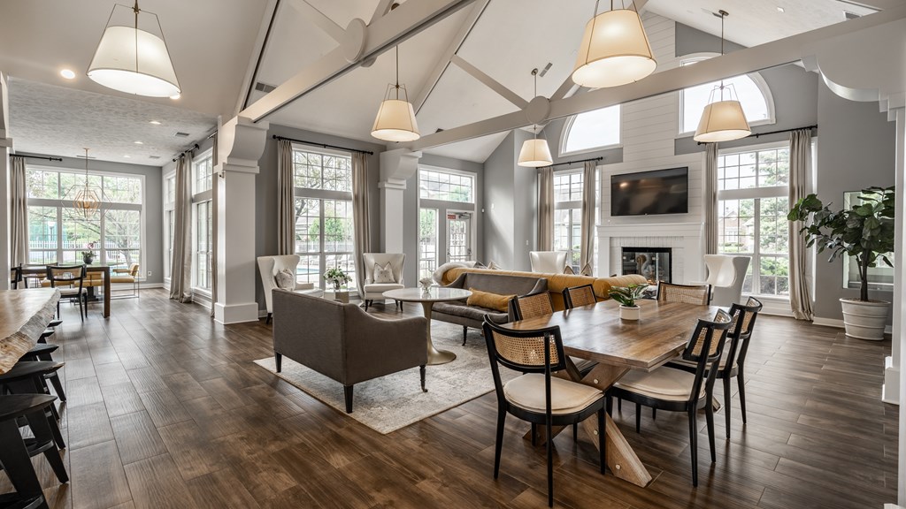 A large, well-lit dining room with a wooden table and chairs at Mallard Bay Apartments, Crown Point, Indiana