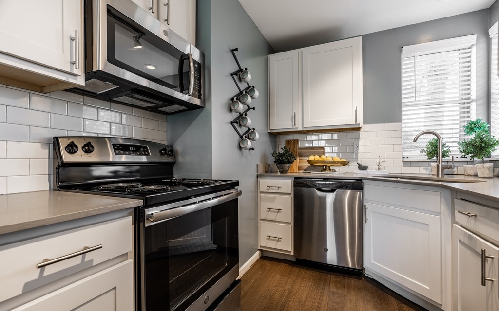 A modern kitchen with a stove, oven, and microwave at Mallard Bay Apartments, Crown Point, Indiana