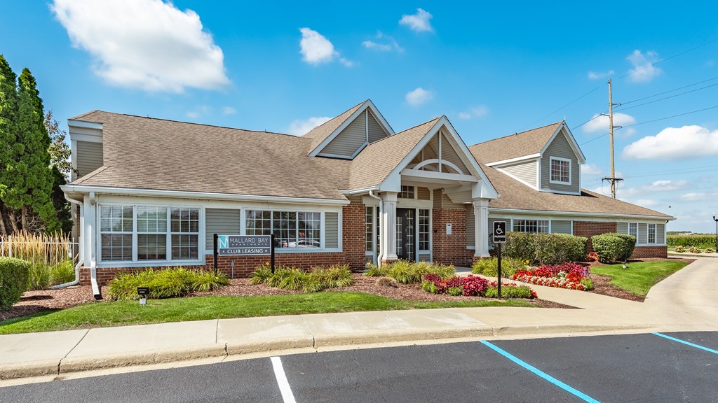A building with a parking lot in front of it at Mallard Bay Apartments, Crown Point, Indiana
