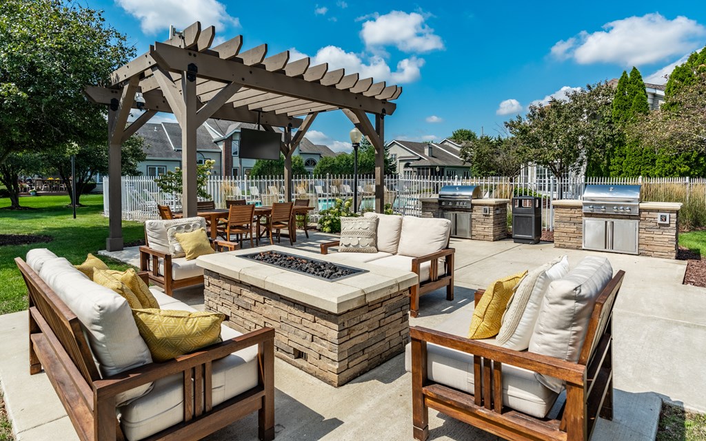 A patio with a fire pit and seating area at Mallard Bay Apartments, Crown Point, Indiana