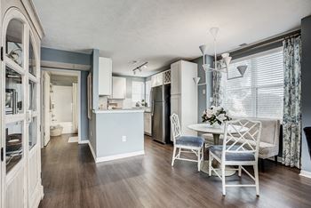 A kitchen with a table and chairs at Mallard Bay Apartments, Crown Point, Indiana