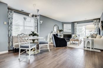 A living room with a black chair in the middle of the room at Mallard Bay Apartments, Crown Point, 46307