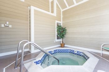 A hot tub in a room with wooden walls at Mallard Bay Apartments, Crown Point, IN