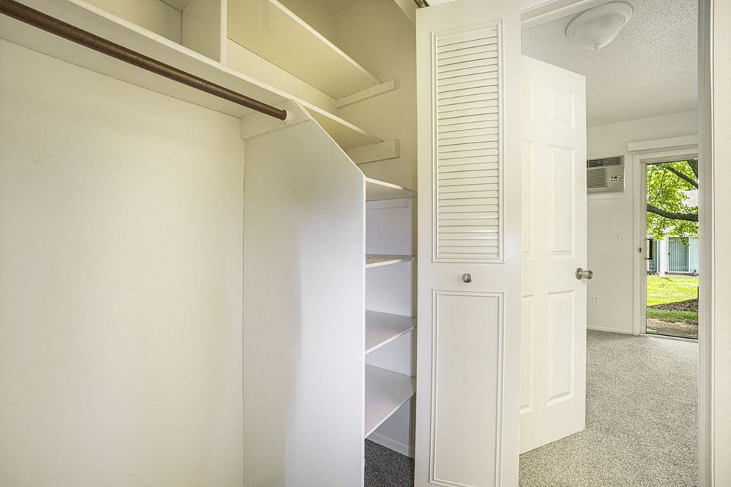 a large closet with shelves at Newport Village Apartments, Portage, MI