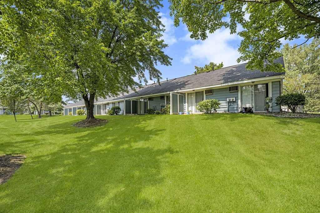 Patios with a semi private fence at Newport Village Apartments, Portage, MI