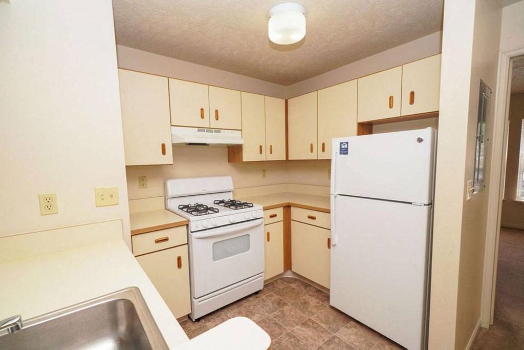 a two bedroom kitchen with white appliancesat North Pointe Apartments, Elkhart, IN 46514