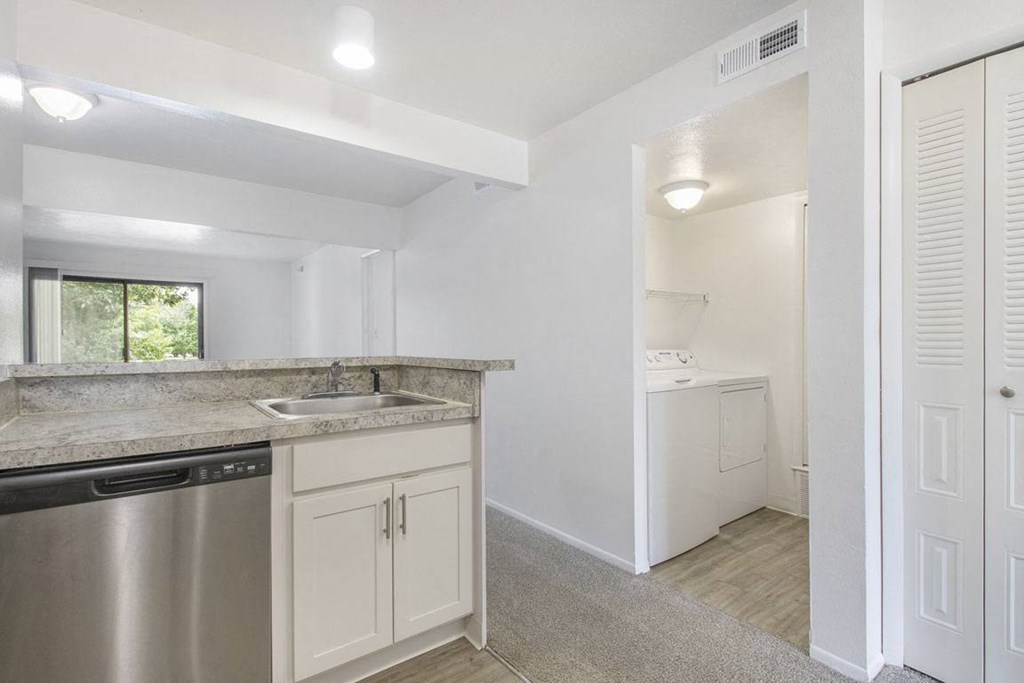 a kitchen view of a laundry room at North Pointe Apartments in Elkhart, IN
