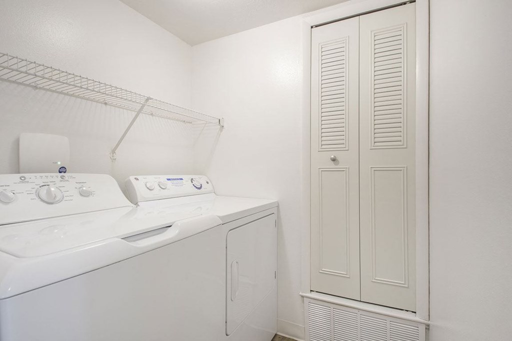 a laundry room with a washer and dryer at North Pointe Apartments in Elkhart, IN