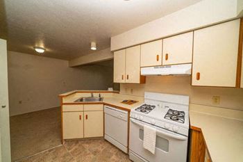 Kitchen with Breakfast Bar at North Pointe Apartments in Elkhart, IN