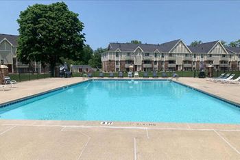 Refreshing Pool With Sundeck at Normandy Village Apartments in Michigan City, IN