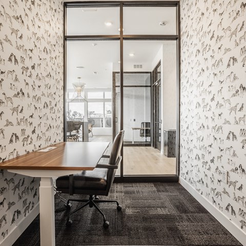 a clubhouse room with chairs and a table at Nuvo Flats, Merrillville, Indiana