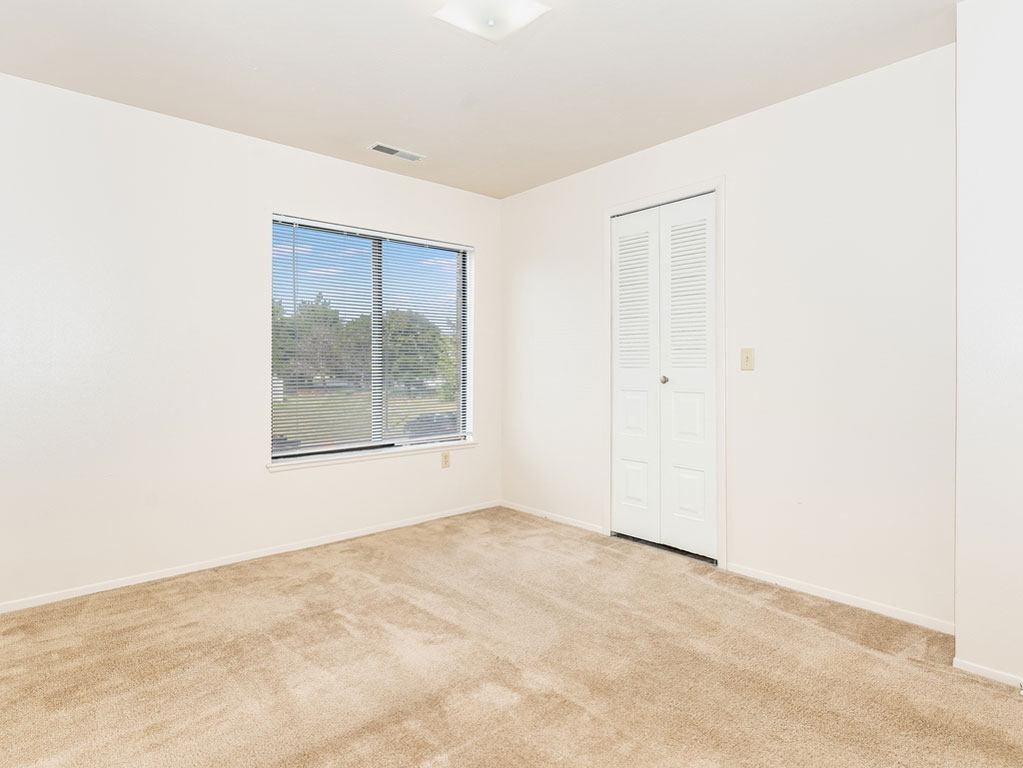 Bedroom with Large Closet at Oak Shores Apartments in Oak Creek, WI