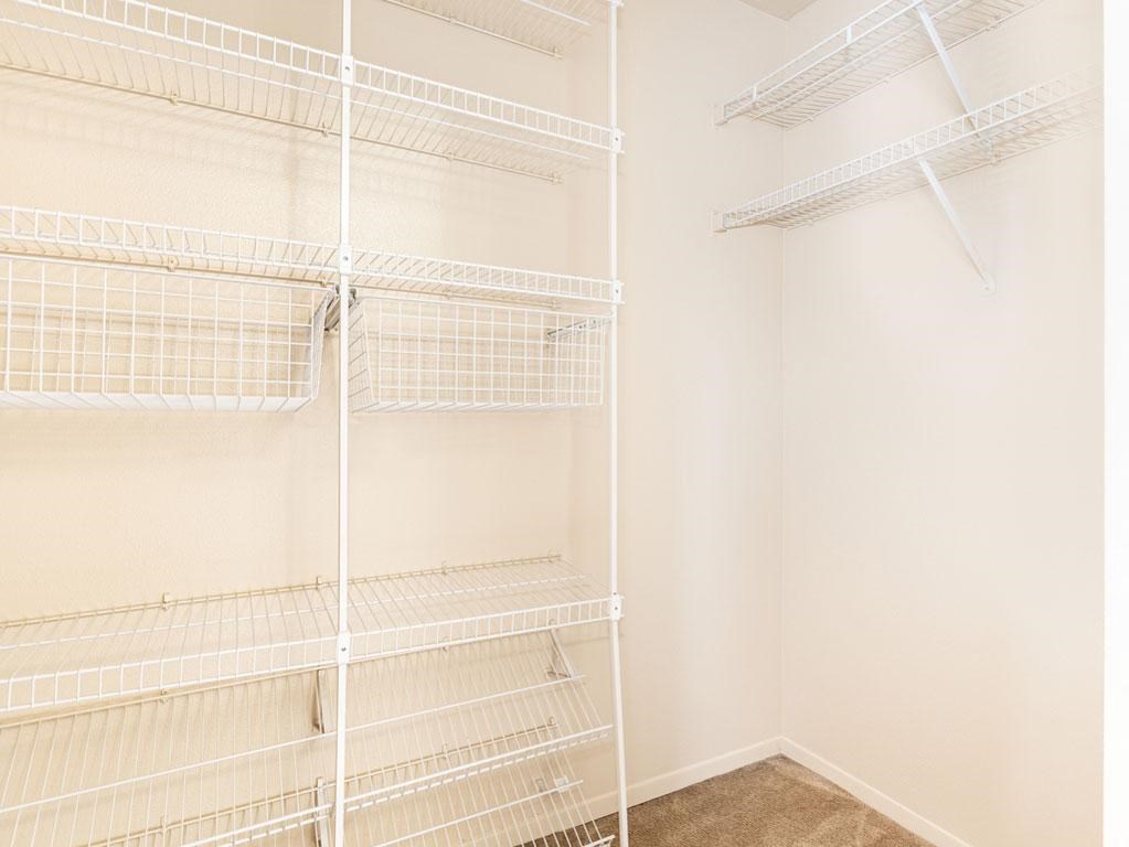 Bedroom with Walk-In Closet at Oak Shores Apartments, Oak Creek