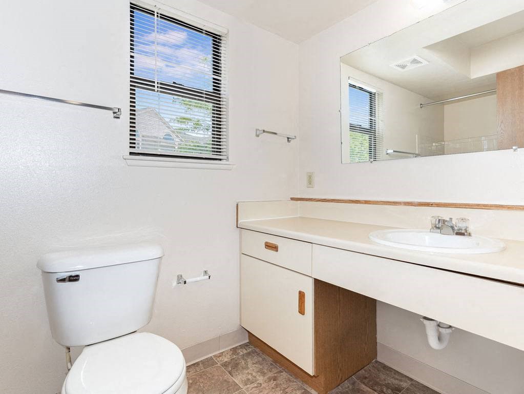 End Bath with Window at Oak Shores Apartments in Oak Creek, WI
