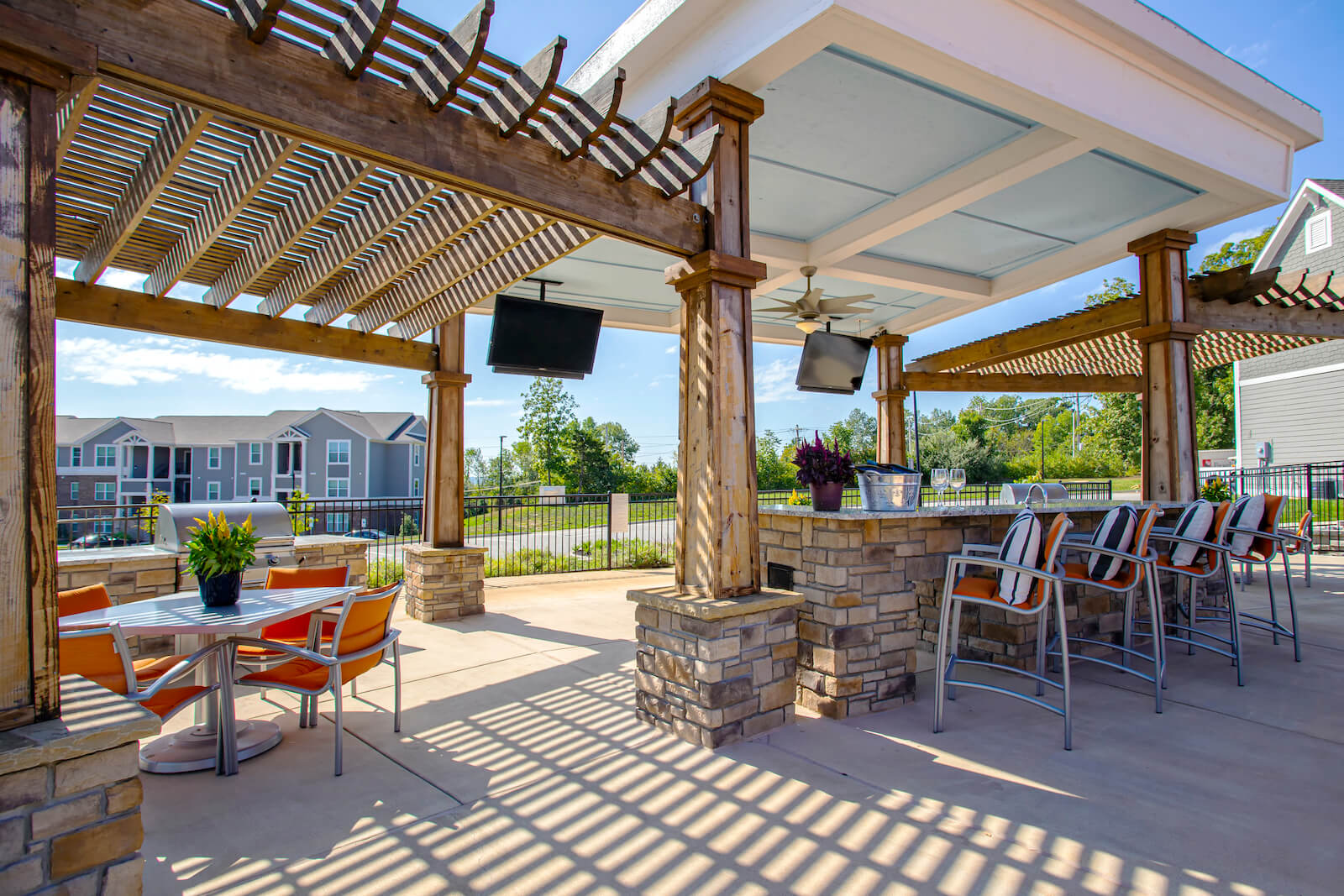 Outdoor TVs, Grilling Station And Entertainment Space at River Crossing Apartments, St. Charles, 63303