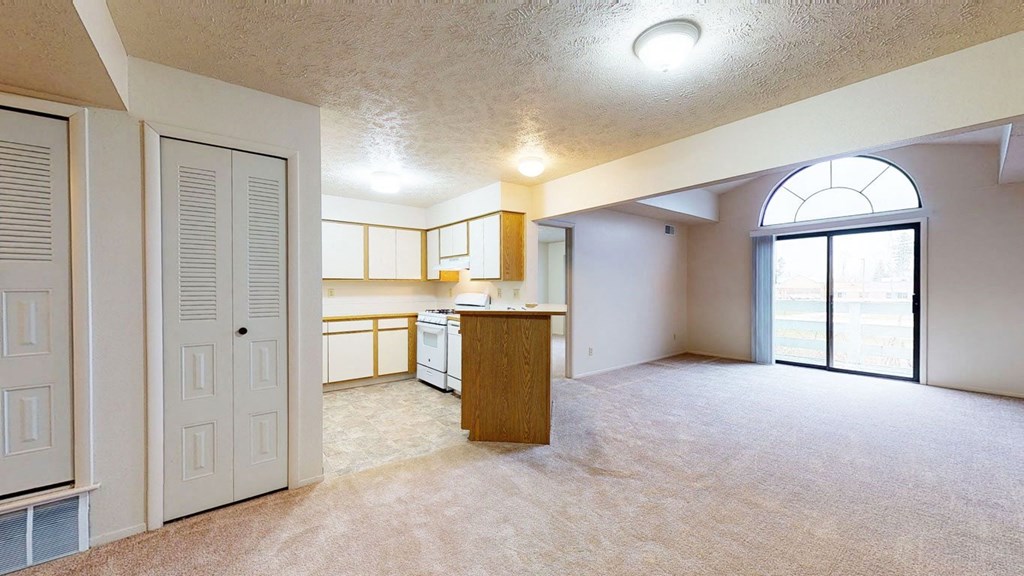 large living room and kitchen with large windows at Pine Knoll Apartments, Battle Creek, 49014