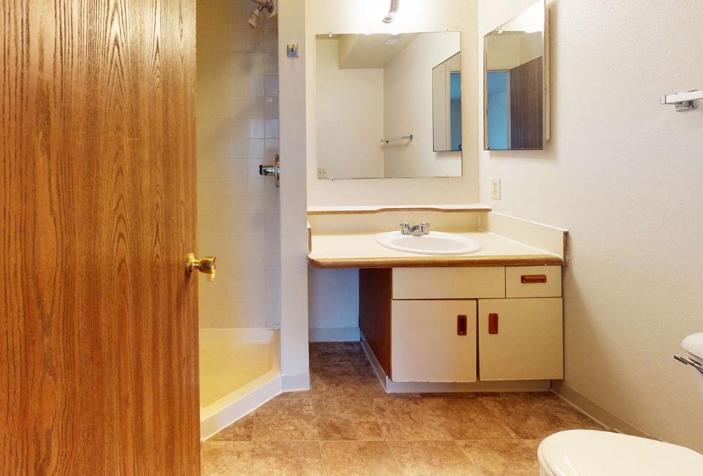 second bathroom with a walk-in shower at Pine Knoll Apartments, Battle Creek, 49014
