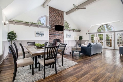 a living room with a dining room table and a couch