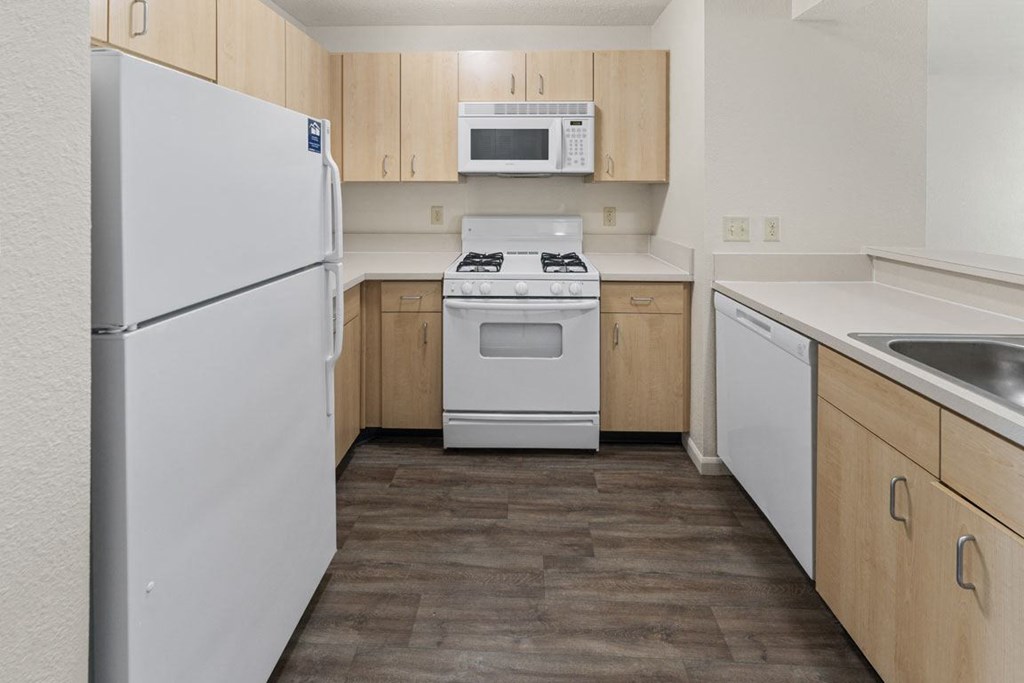 Two Bedroom Kitchen with Microwave and Gas Range at Hunters Pond Apartment Homes, Champaign, IL