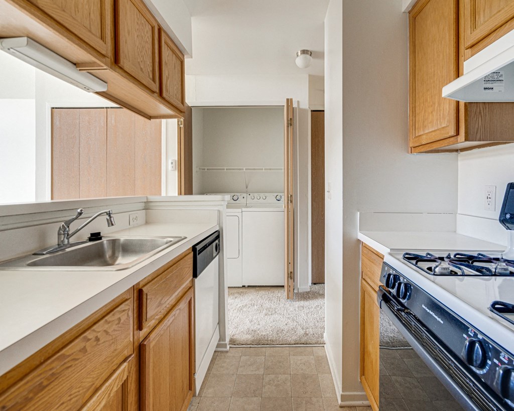 Peony Layout Kitchen with Gas Range at The Harbours Apartments, Clinton Township, Michigan 48038