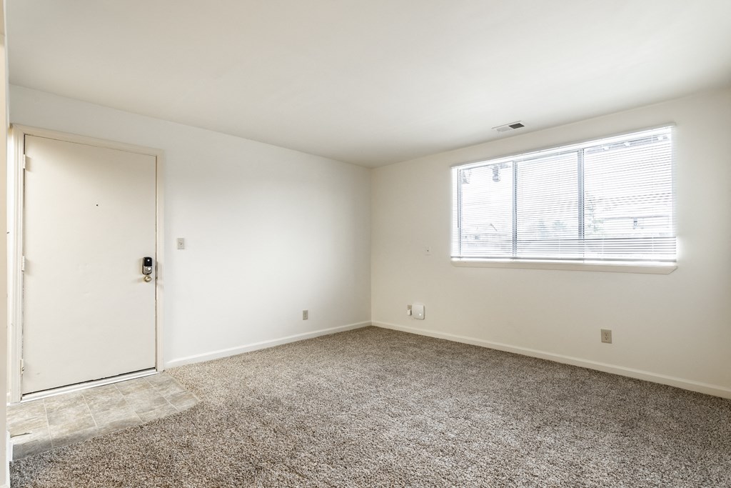 an empty living room with window at Pheasant Run Apartments, Lafayette, 47909