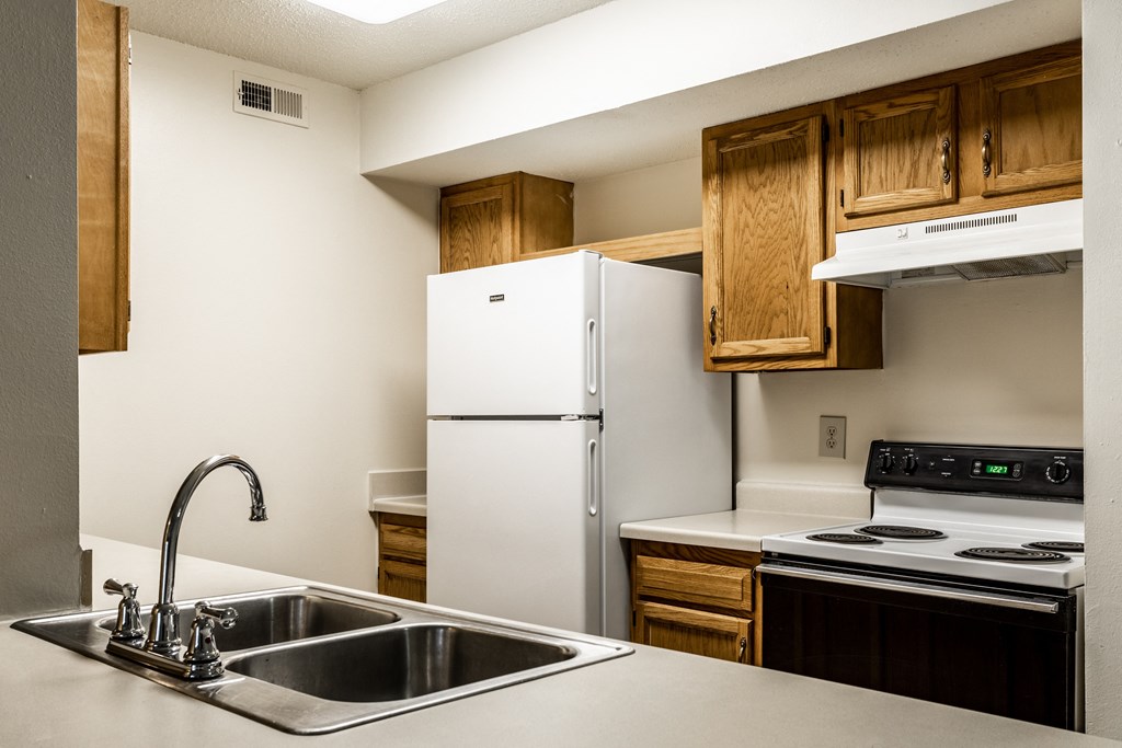 Cabinets with appliances at Pheasant Run Apartments, Lafayette, 47909