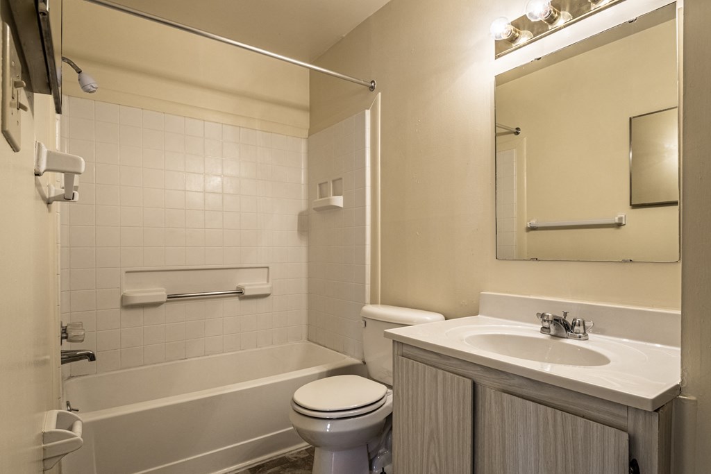 a bathroom with a sink toilet and a bath tub at Scarborough Lake Apartments, Indiana, 46254