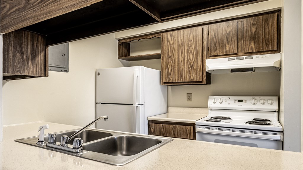 a kitchen with a sink and a stove and a refrigerator at Scarborough Lake Apartments, Indianapolis, Indiana