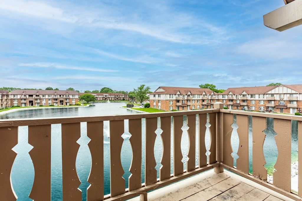 the view from the balcony of an apartment building overlooking a lake at Scarborough Lake Apartments, Indianapolis, Indiana, 46254