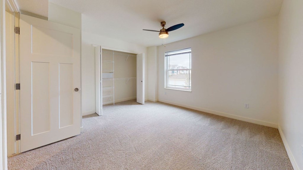 Spacious Bedroom with Large Closet at The Reserve at Destination Pointe in Grimes, IA with