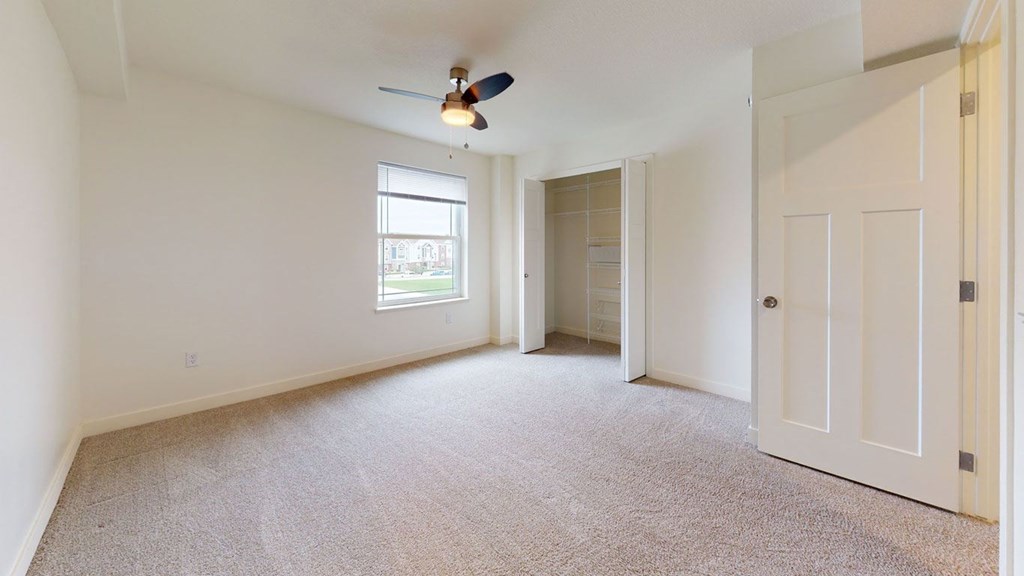 Bedroom with Large Walk-In Closet at The Reserve at Destination Pointe in Grimes, IA with