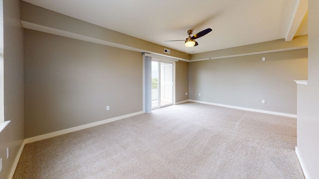 Enlarged Living Room at The Reserve at Destination Pointe in Grimes, IA with