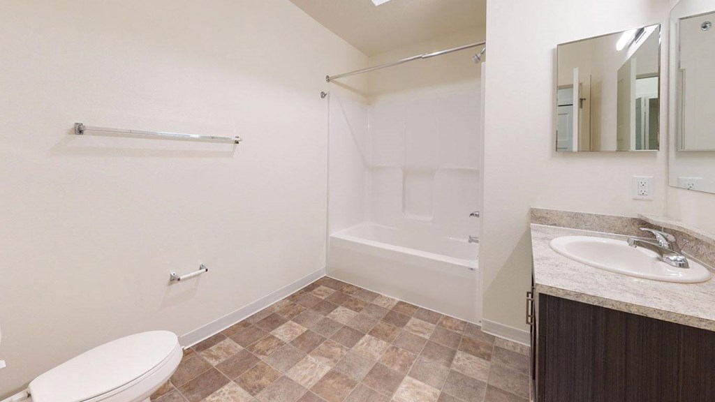 Master Bath with Bathtub at The Reserve at Destination Pointe in Grimes, IA with