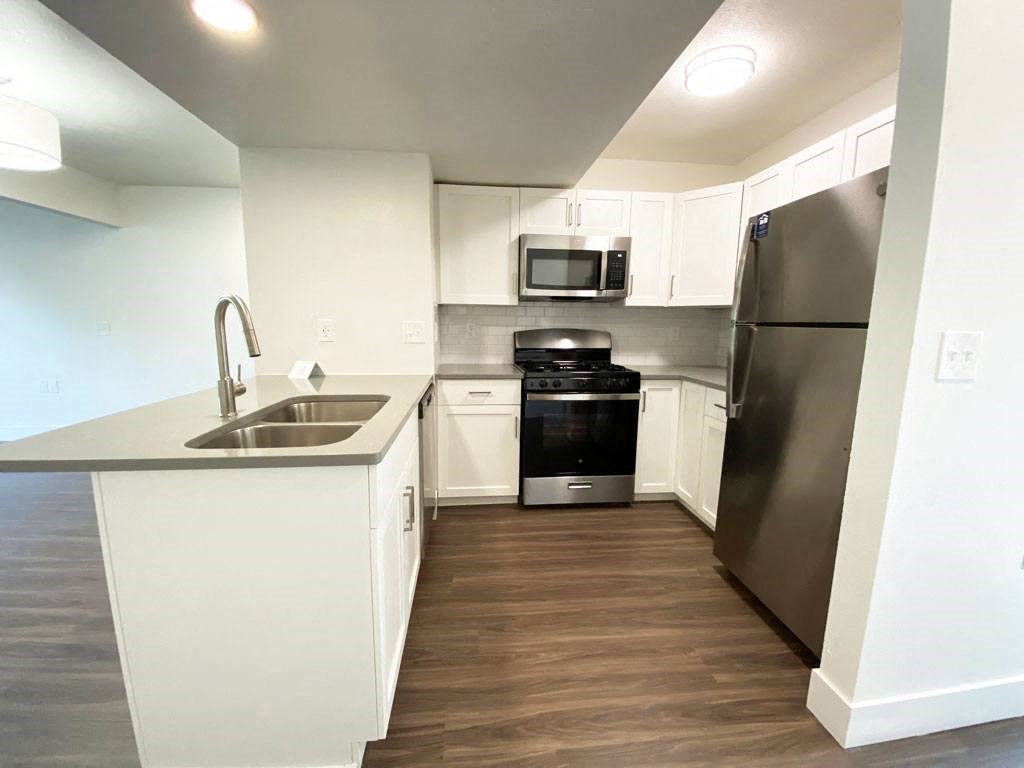 Modern Kitchen with Breakfast Bar at Green Ridge Apartments in Grand Rapids, MI