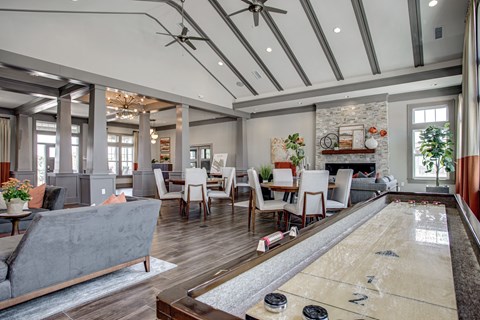 A room with a shiny wooden floor and a pool table. at River Crossing Apartments, Missouri, 63303