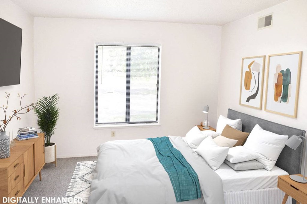 Bedroom with a window in it at Seville Apartments in Kalamazoo, MI 49009