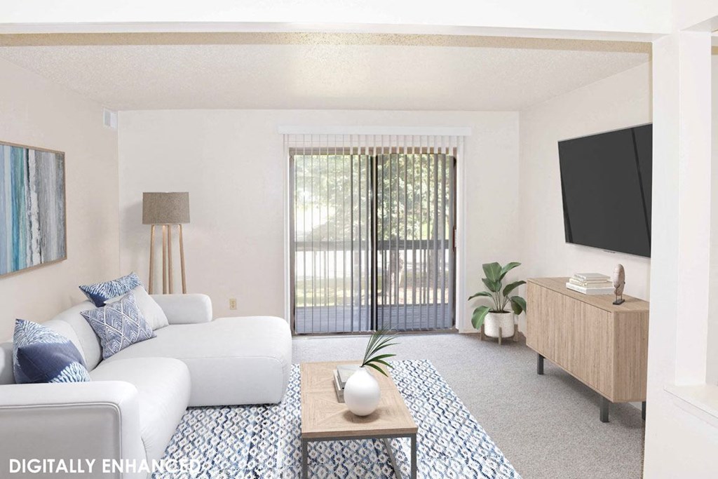 living room with a sliding glass door at Seville Apartments in Kalamazoo, MI 49009