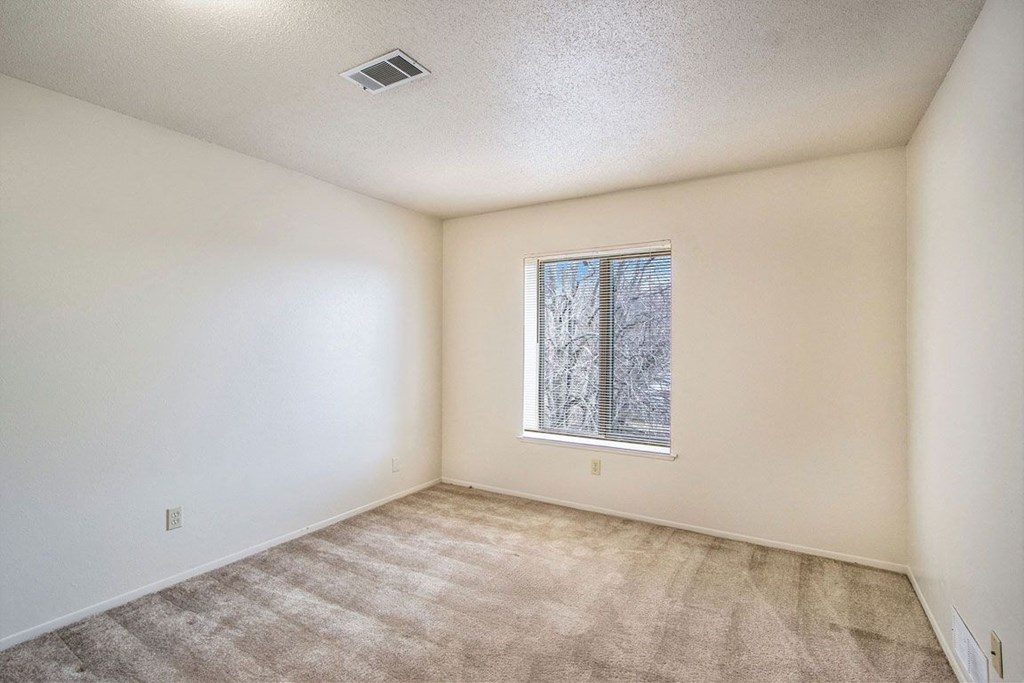 Carpeted bedroom at Seville Apartments, Michigan, 49009