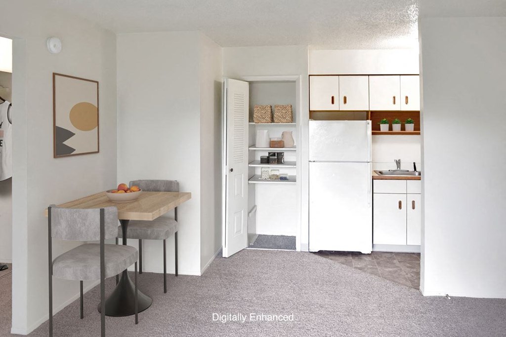 a kitchen and dining room with a closet at Seville Apartments, Kalamazoo, 49009