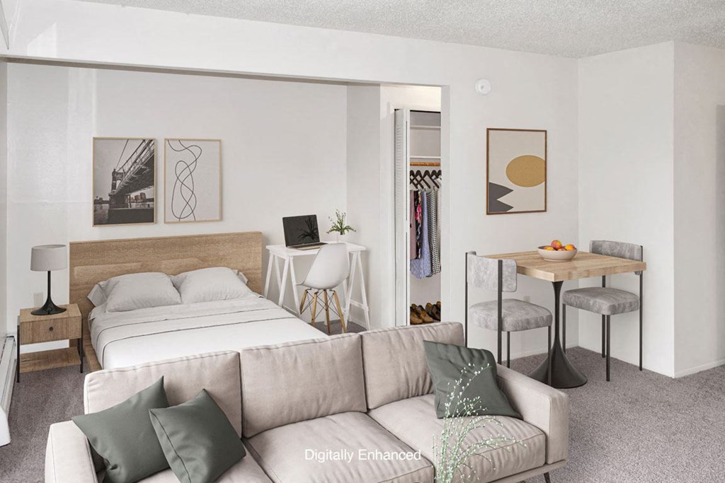 a living room with a sleeping area at Seville Apartments, Kalamazoo, 49009