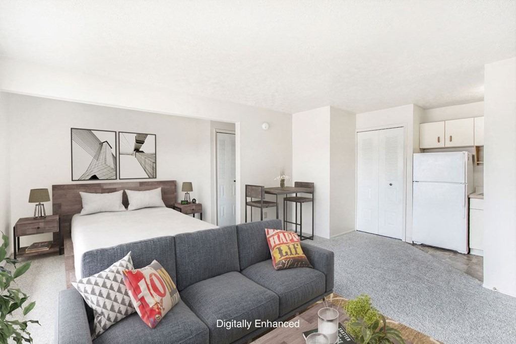 a living room leading to the kitchen at Seville Apartments in Kalamazoo, MI 49009