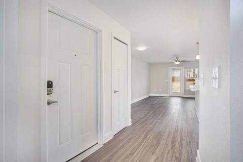 Hallway leading to living room with wood floors  at Signature Pointe Apartment Homes, Athens