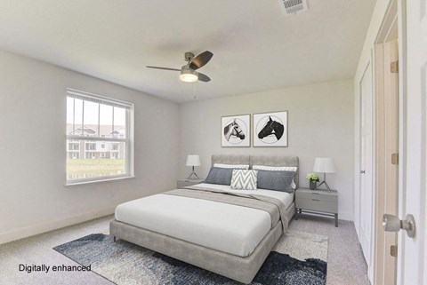 a bedroom with a bed and a ceiling fan  at Signature Pointe Apartment Homes, Alabama, 35611