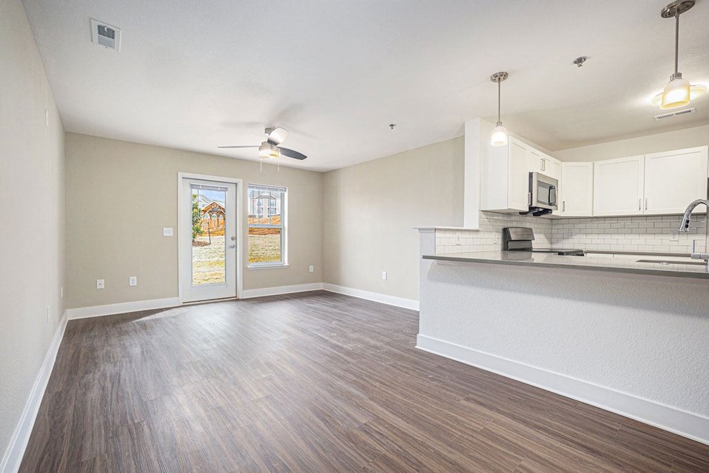 Open living room with a ceiling fan at Stoney Pointe Apartment Homes, Wichita