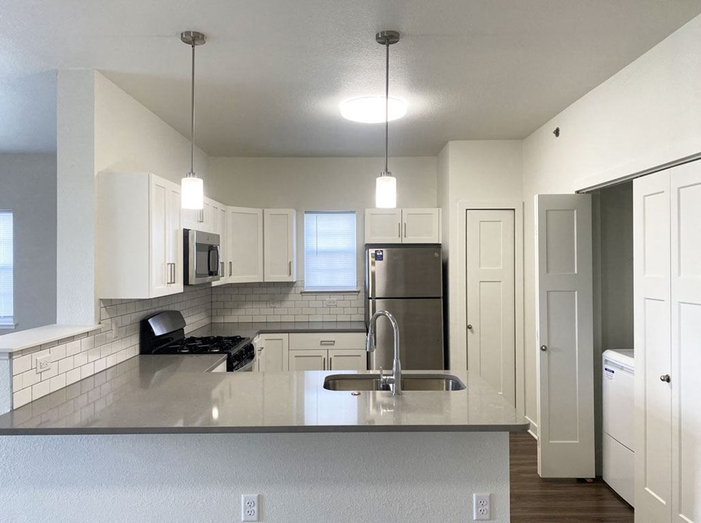 an end style kitchen with a window at Stoney Pointe Apartment Homes, Wichita, Kansas