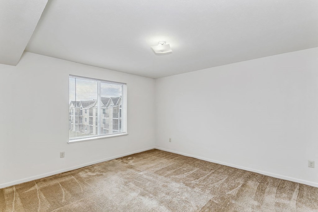 Large Bedroom Windows at Stoney Pointe Apartment Homes in Wichita, KS
