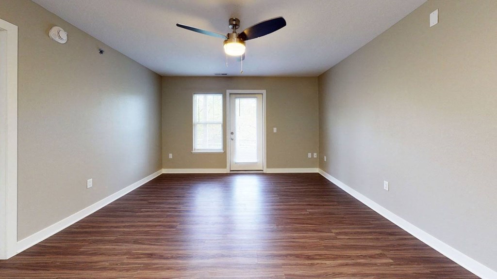living room with hard-surface floors and a ceiling fan at Strathmore Apartment Homes, West Des Moines, 50266