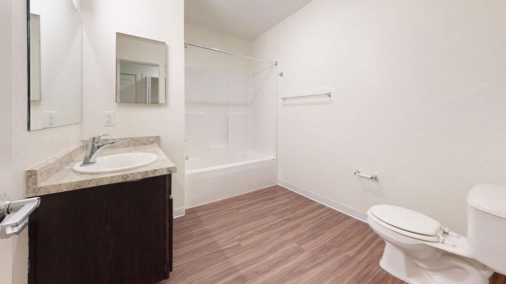 a bathroom with hard-surface flooring at Strathmore Apartment Homes, West Des Moines, 50266