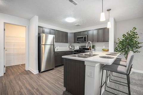 a kitchen with stainless steel appliances and a counter top