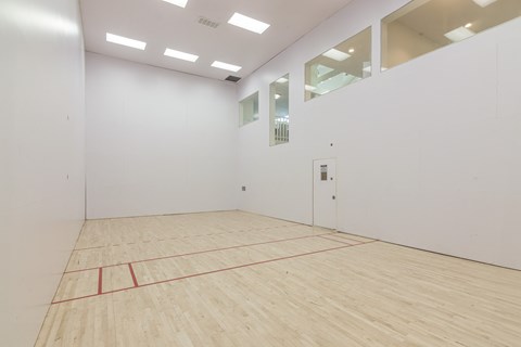 A room with a wooden floor and a red line running across it. at Sundance Apartments, Indianapolis, 46237